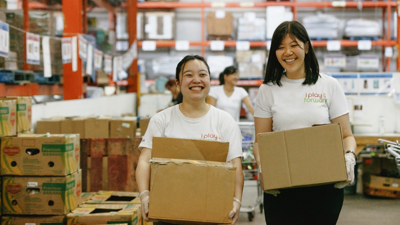 BCLC volunteers carry boxes at GVFB