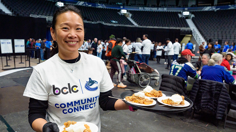 BCLC volunteering serving food at the Nourish the Neighbourhood community event