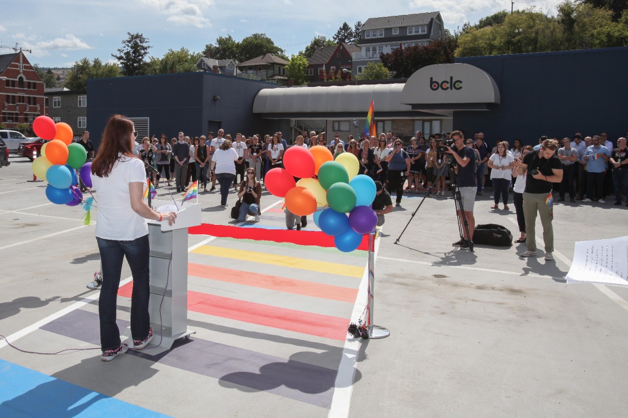 PRIDE crosswalk with multi-coloured balloons