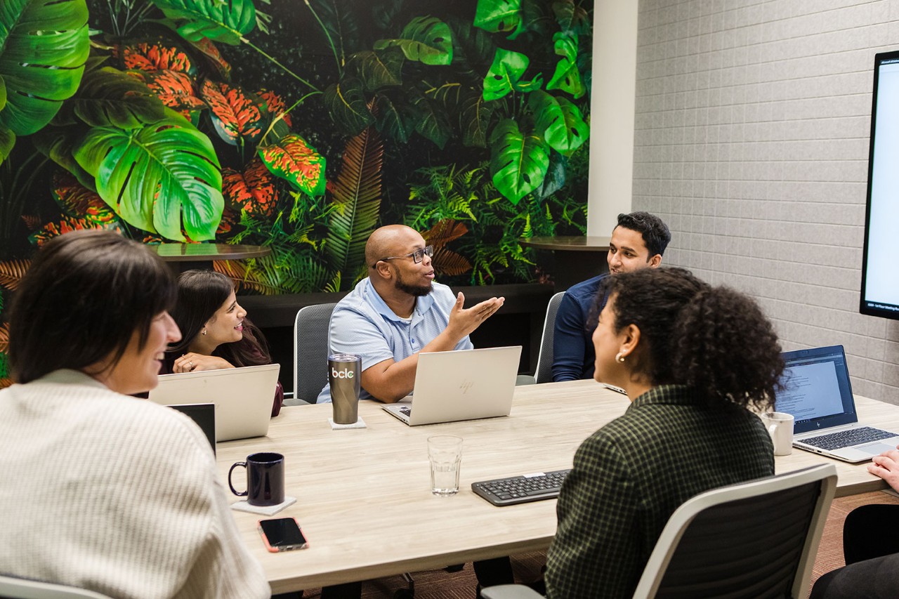Employees in a meeting space in the Kamloops office