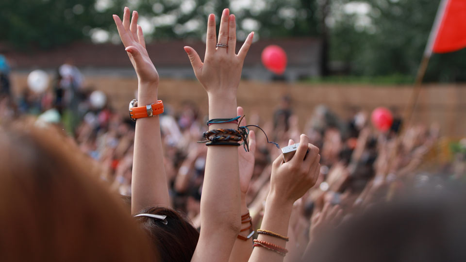 Crowd of people dancing at a festival