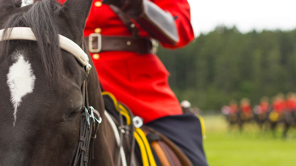 RCMP in red jacket on a horse