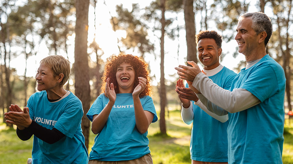 Group of people high fiving.