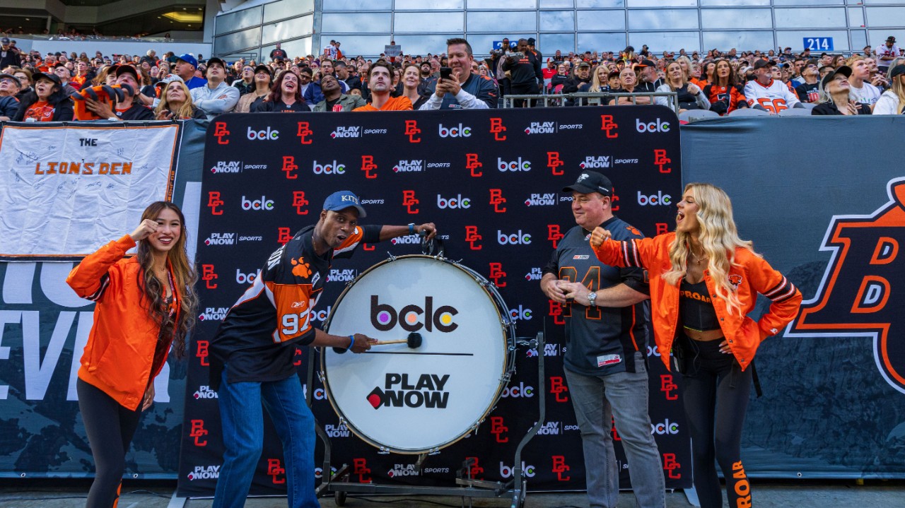 photo of hero pumping up the crowd at the BC Lions game