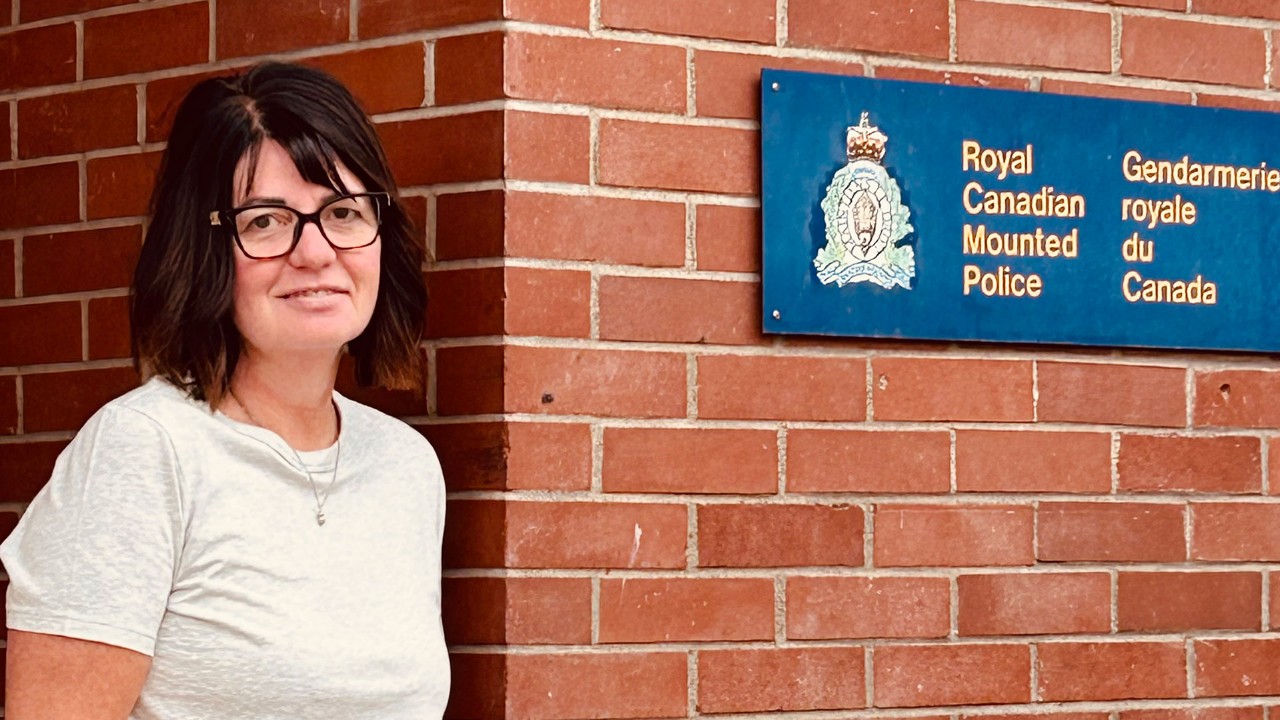 Sharon standing outside of the RCMP detachment