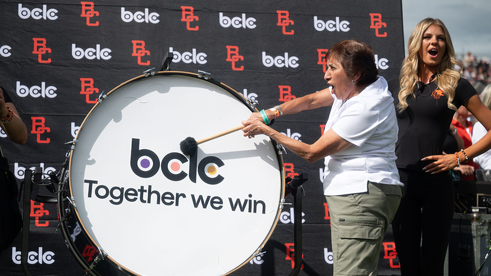 Community Hero banging the drum