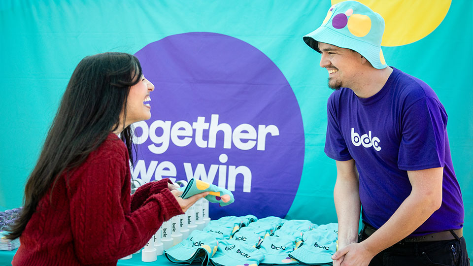 Two people connecting at a community event