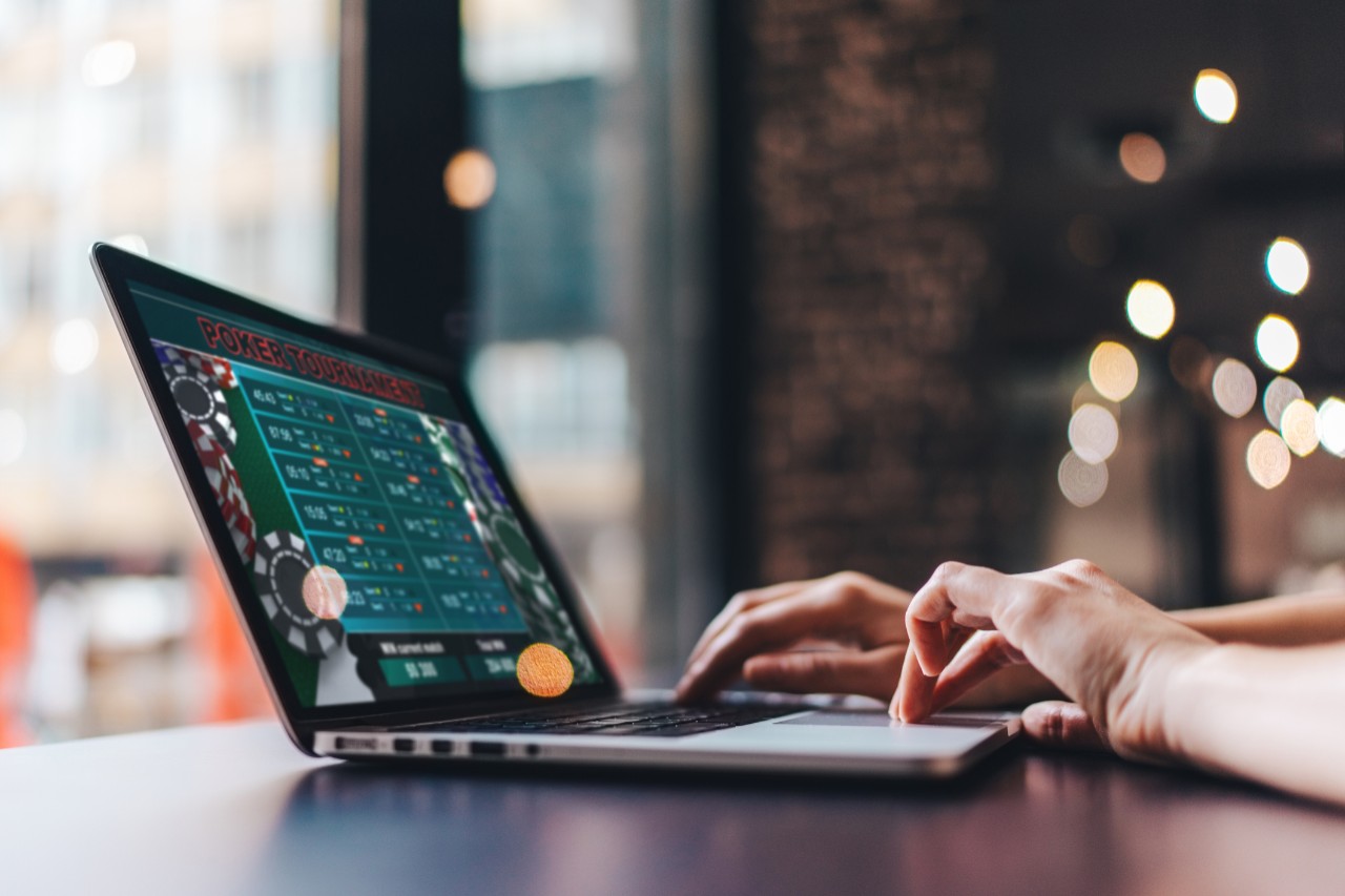 Person gambling on a laptop